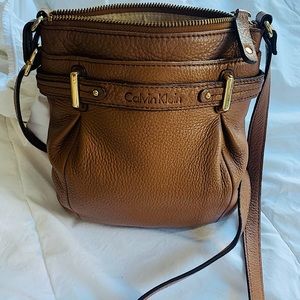 Calvin Klein tan leather cross-body purse.